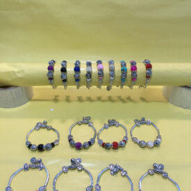 1284 pulseras con piedras al azar